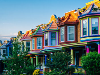 Colorful street of row homes best airbnbs in baltimore