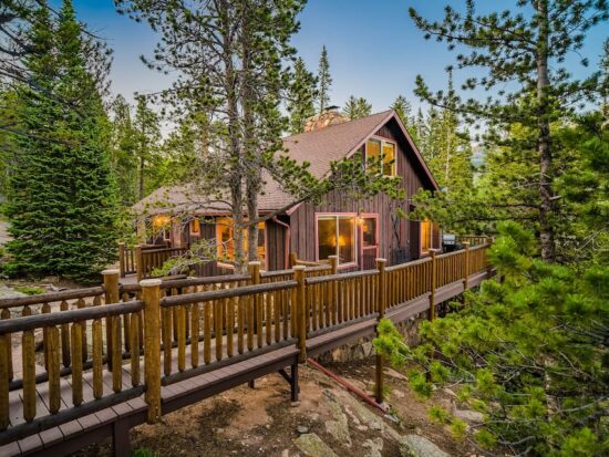 a photo of a tranquil mountain get away, a top cabin in Estes Park
