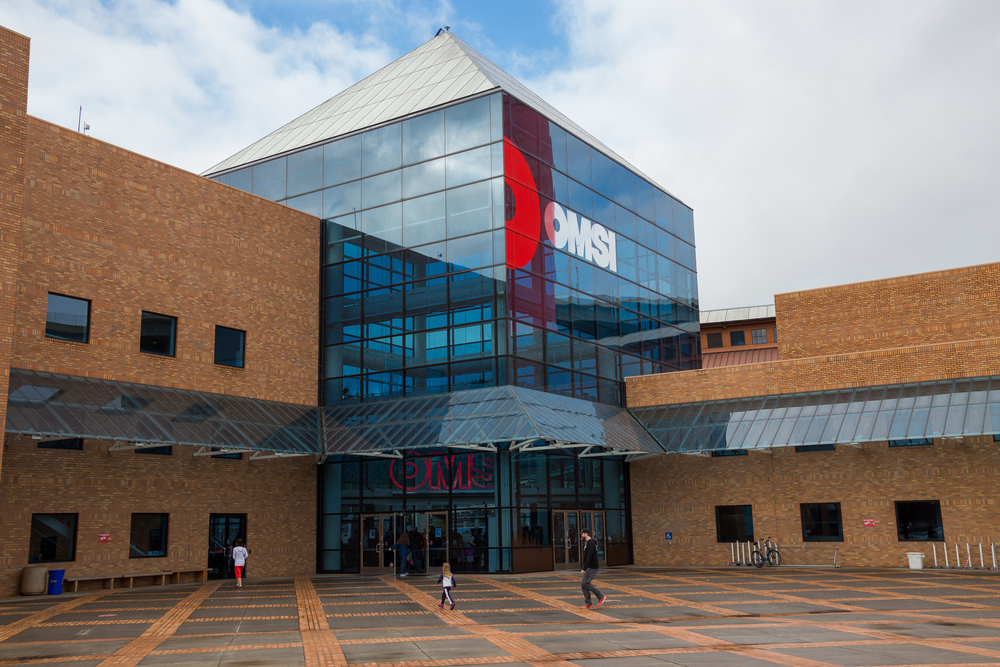 The large brick and glass entryway to the Oregon Museum of Science and Industry, one of the best things to do in Portland.