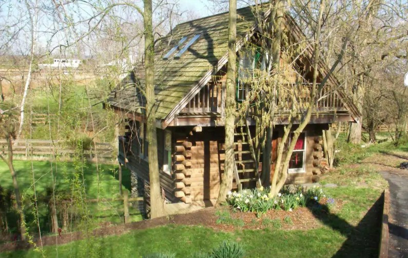 Log house surrounded by garden and woods one of the best cabins in Maryland