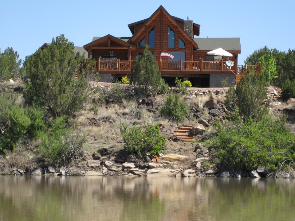 This waterfront Show Low home on a private lake with a deck is one of the best cabins in Arizona