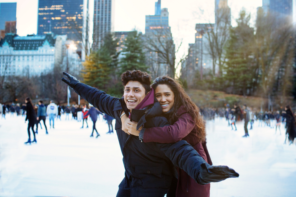 A couple ice skating at Rockefeller Plaza in New York City