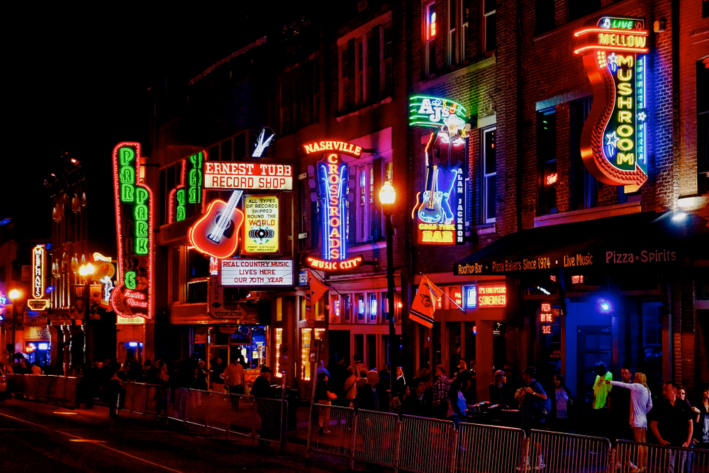 The streets of Nashville Tennessee all lit up at night one of the best honeymoons in the usa