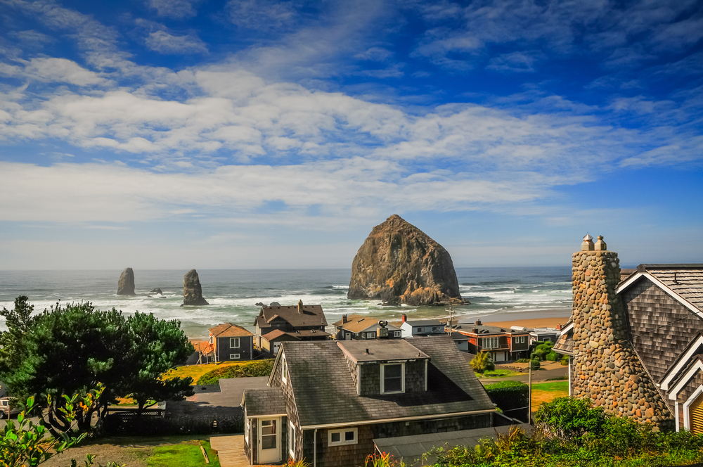 View of a beach in Seaside Oregon looking out at Haystack Rock.