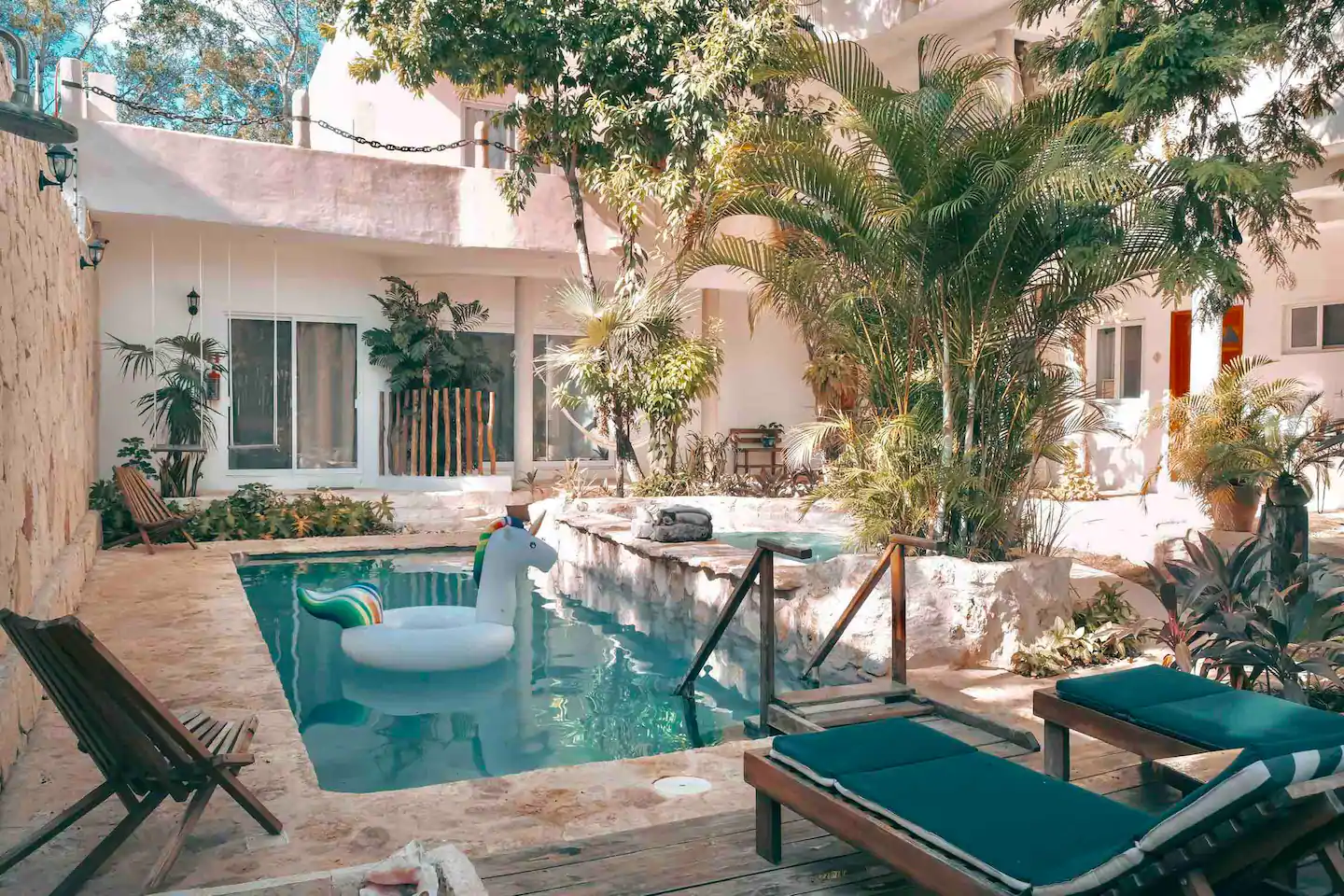 Stay at the Casita Maya Loft to enjoy one of the best Airbnbs in Tulum! This is view of the private pool and lush landscaping