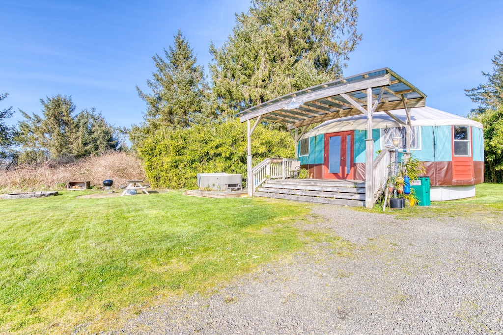 image of the exterior of a teal and orange yurt