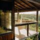 a treehouse in the hills of Hawaii with a hammock on a lanai