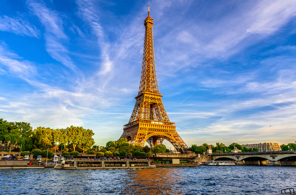 The Eiffel Tower in Paris France on a beautiful day against a bright blue sky