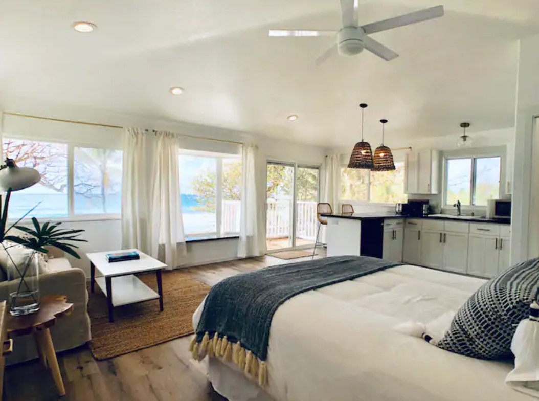 Interior view of a studio that looks out onto the pacific ocean best airbnbs in hawaii