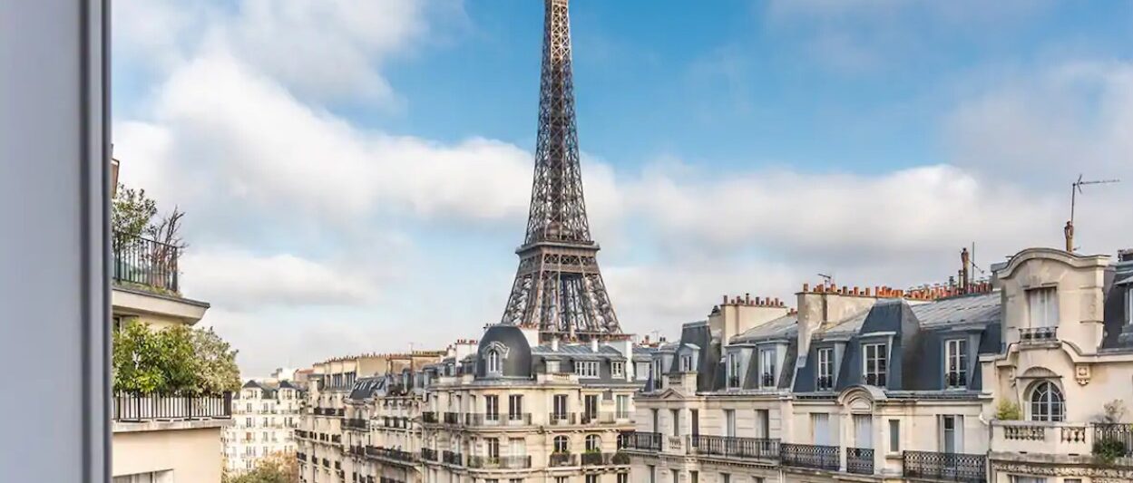 a view of the Eiffel Tower and the streets of Paris from a private balcony