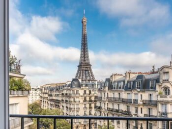 a view of the Eiffel Tower and the streets of Paris from a private balcony