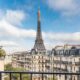 a view of the Eiffel Tower and the streets of Paris from a private balcony