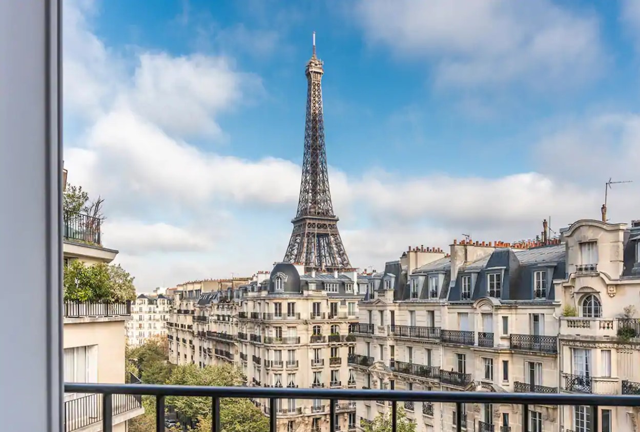 The view of the Eiffel Tower and the streets of Paris from a private balcony in an apartment in Paris