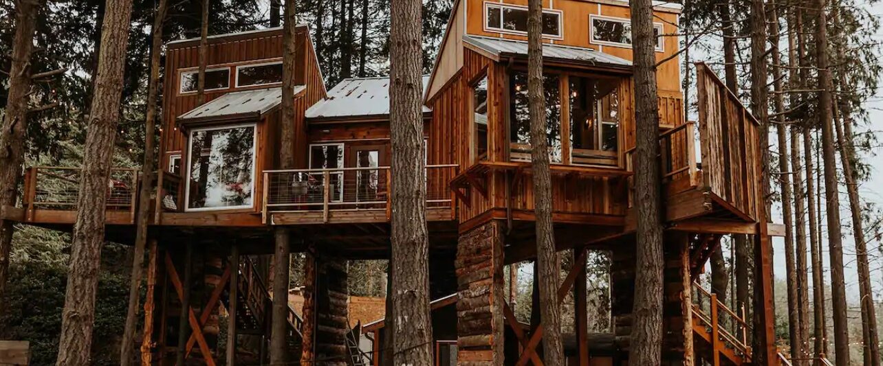 A large treehouse perched in the woods of Washington State