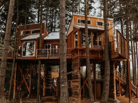 A large treehouse perched in the woods of Washington State