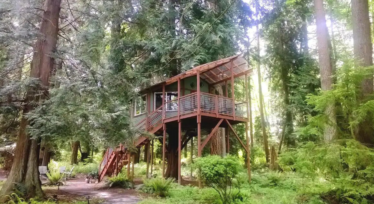 A large treehouse perched in the woods on Whidbey Island Washington