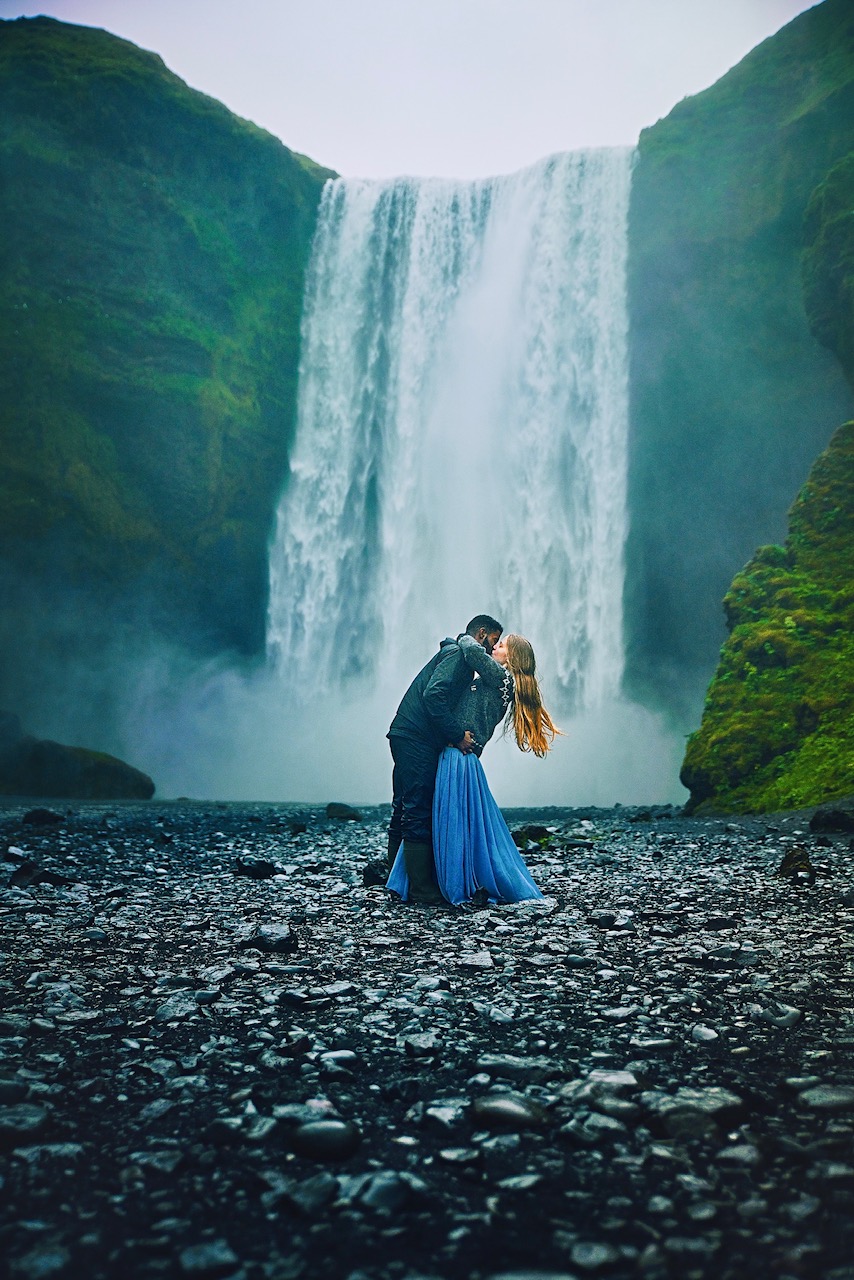 wilderness quotes. couple kissing in front of waterfall.