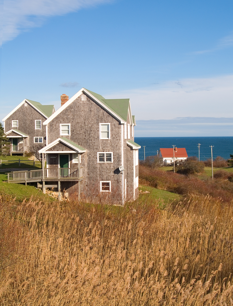 beach homes on the shore of Block Island Rhode Island surrounded by grassy dunes