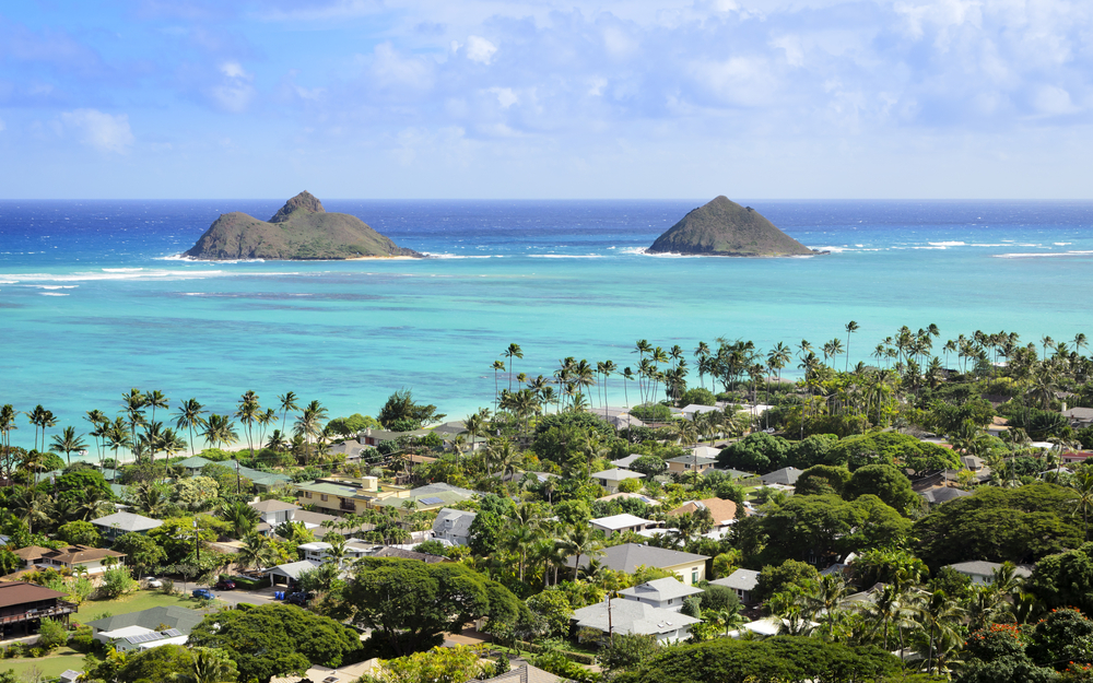 An overhead view of Kailua Hawaii with views out to the ocean and two smaller islands on a sunny day