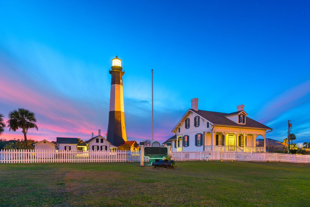 A lighthouse at sunset on Tybee Island in Georgia best small beach towns in the usa