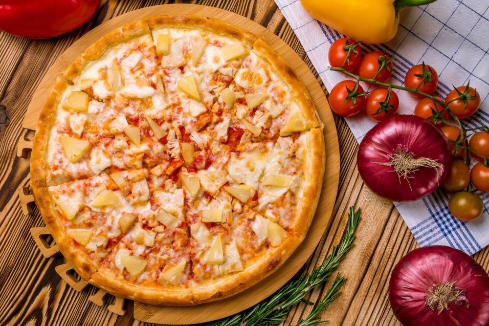 a pineapple and Canadian bacon pizza is offered at Rooftop Pizzeria which is one of the best restaurants in Santa Fe