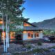 a modern mountain home at twilight VRBO in Colorado