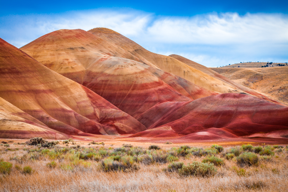 The bright red and orange striped hills of the Painted Hills Overlook Hike.