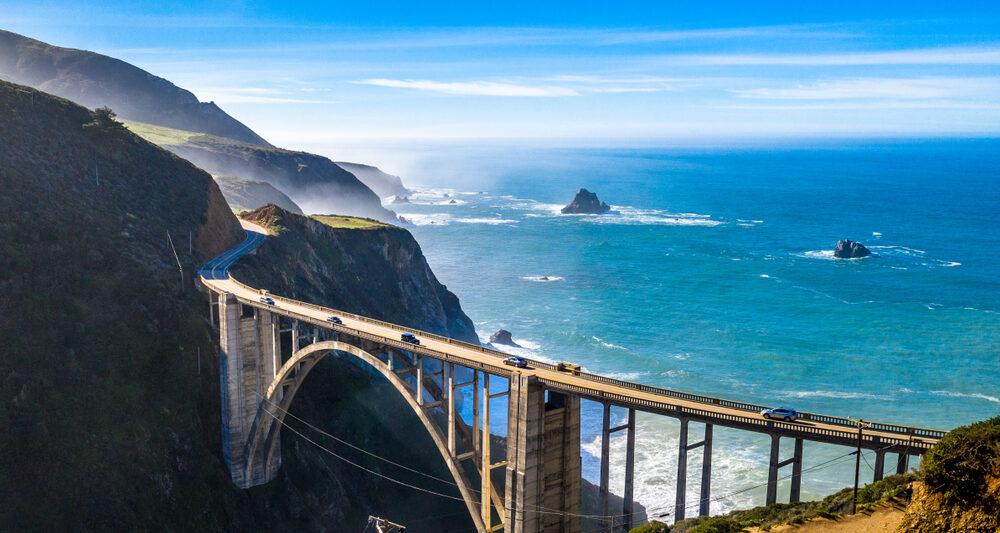 The view of Bixby Bridge with the Pacific Ocean in the back ground. It is the most popular stop on a Big Sur road trip.