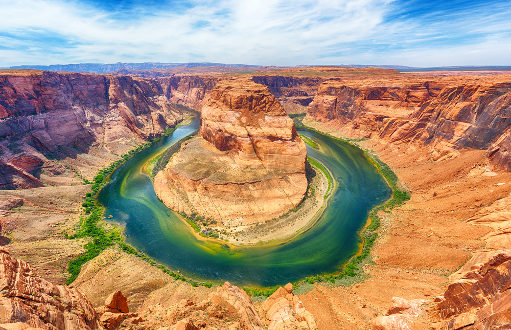 The Horseshoe Bend on the edge of the Grand Canyon outside of Page Arizona. It is a large horseshoe shaped bend in the Colorado River that was carved into the red sandstone by the river. 