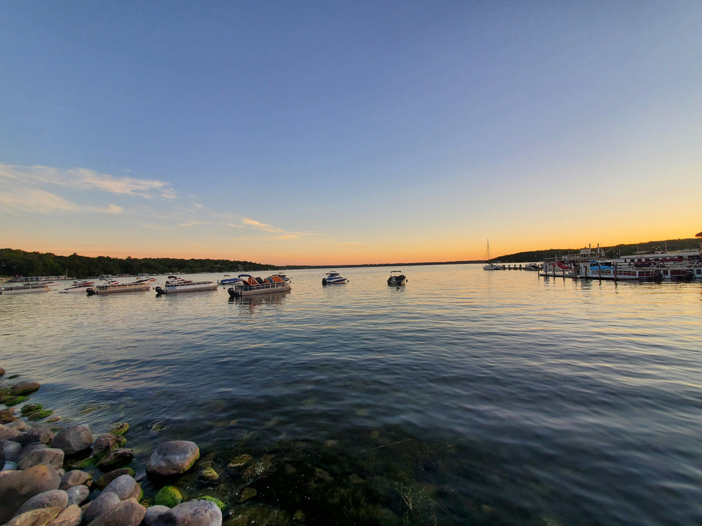 Boats in the water at Lake Geneva at sunset. One of the best bachelorette party destinations.