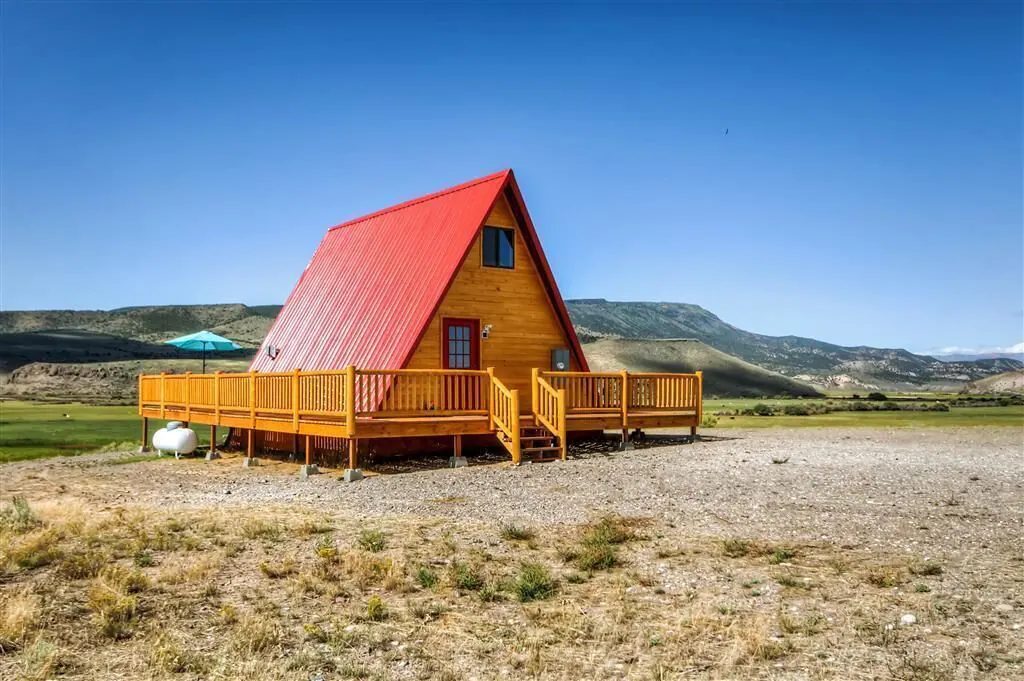 a photo of a quaint & rural a-frame one of the top romantic cabins in Utah