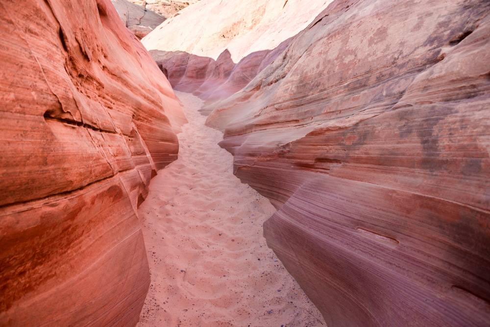 the colorful pastel walls and fine sand of Pink Canyon