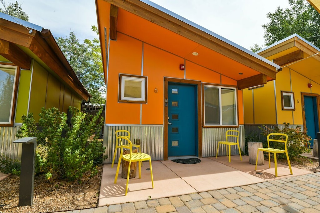 Colorful orange and blue exterior of West 6, one of the best airbnbs in Moab. 