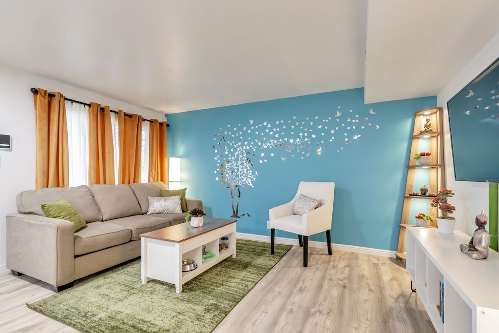 Photo of the zen blue and green living room of the Apartment near the Capitol. 