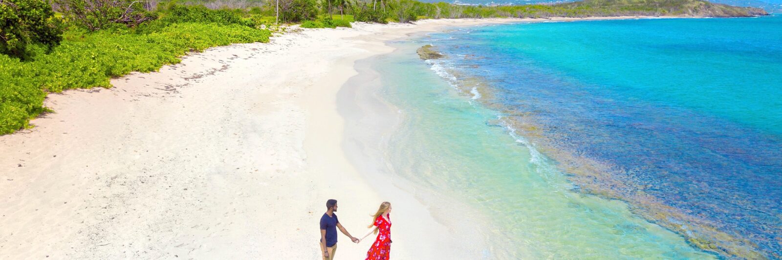 woman and man holding hands on one of the best islands in the USA