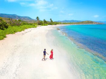 woman and man holding hands on one of the best islands in the USA