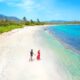 woman and man holding hands on one of the best islands in the USA