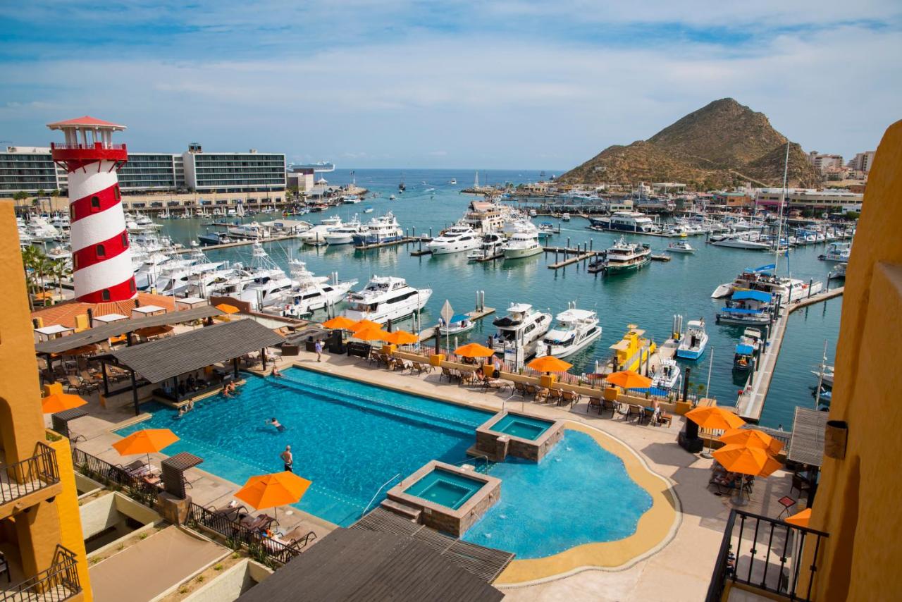 The view of the pool, lighthouse, and marina from a room at an all-inclusive resort in Mexico. 