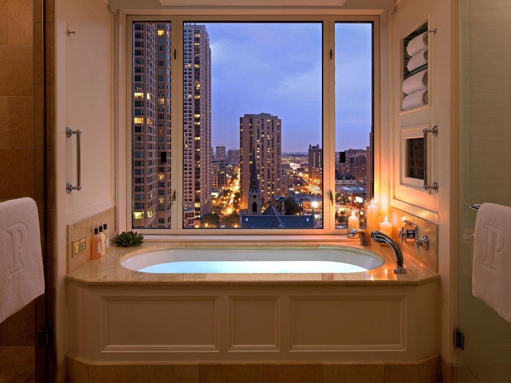 A large soaking tub that looks out on the Chicago skyline. 