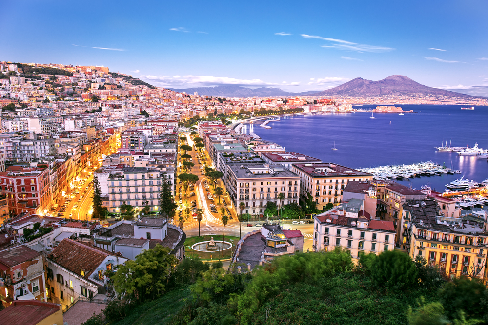 Panoramic view of Naples viewed from above at dusk.