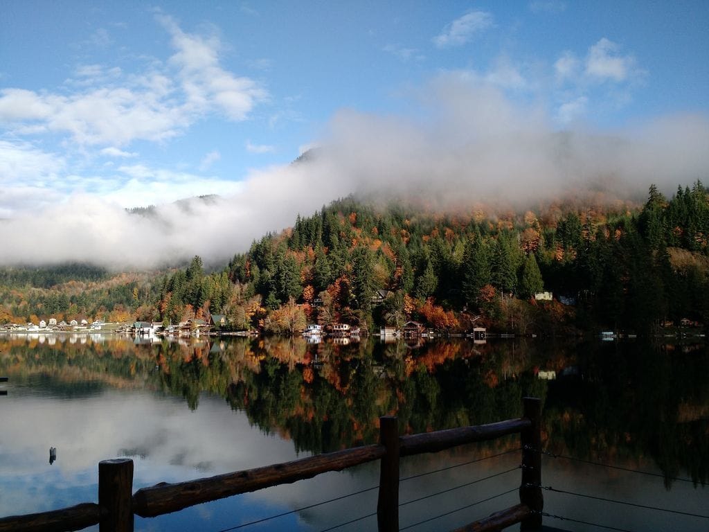 View of the hills, lake, and mist from the deck of this VRBO