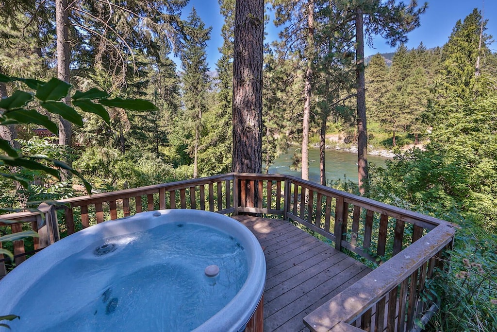 View of a hottub overlooking a green flowing river in Washington State 