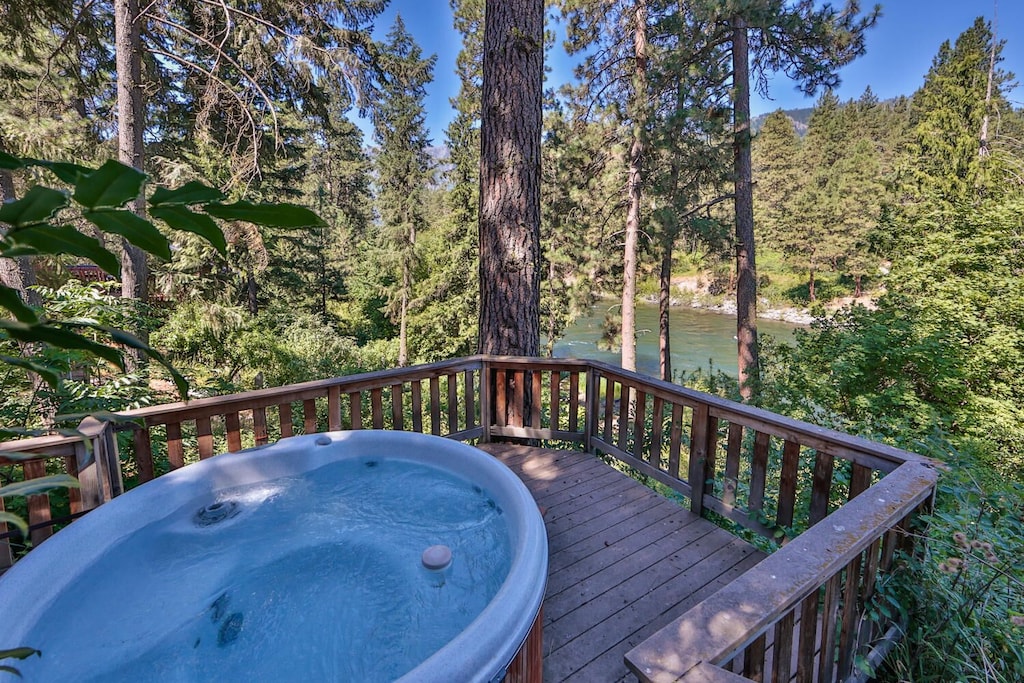 View of a hottub overlooking a green flowing river in Washington State
