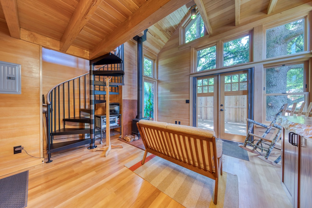 view of the light and bright interior and impressive tree line view of one of the best cabins in Oregon 