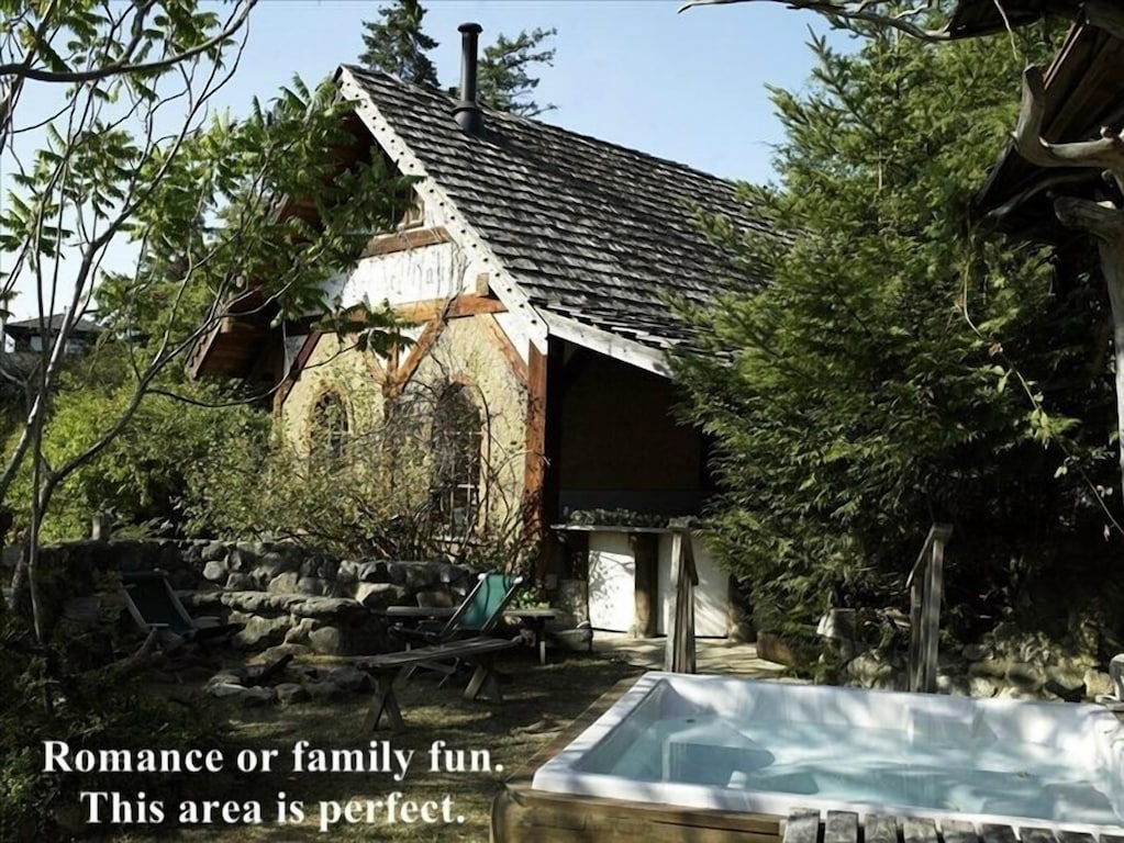 exterior of the Gnome house with view of the hot tub. This is one of the best cabins in Washington State.