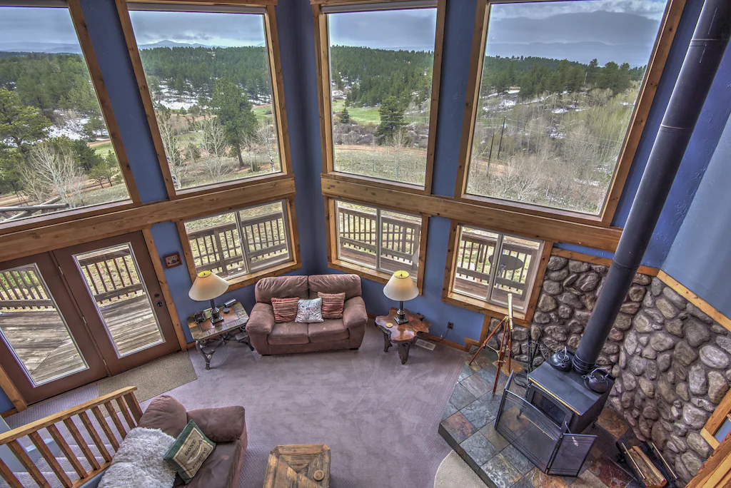 One of the best cabins in Colorado for the view. The picture shows the hige windows that overlook the valley below. 