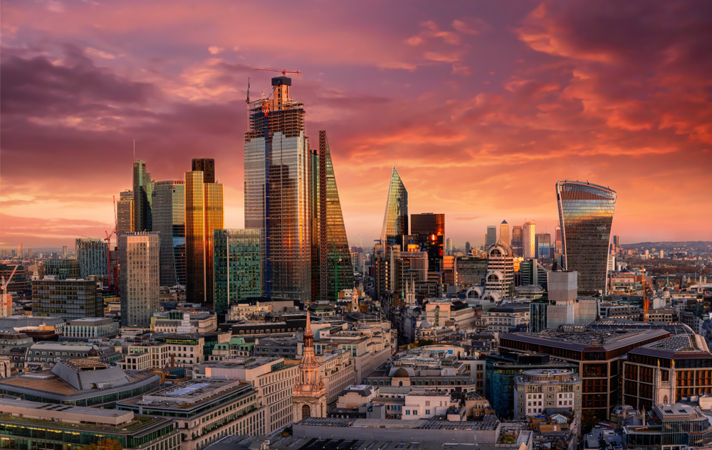 Vivid sunset over the financial district skyline of London.