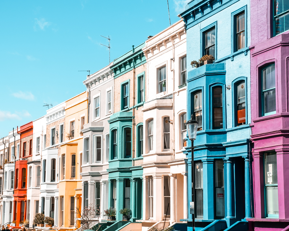 Row of brightly colored houses in Notting Hill, where to stay in London.