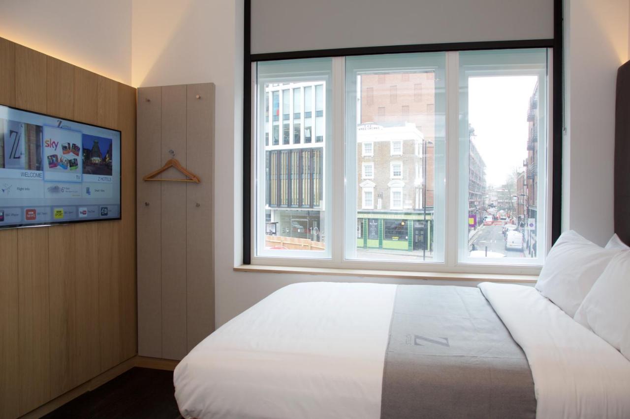 Basic room at the Z Hotel Shoreditch with a TV and window.