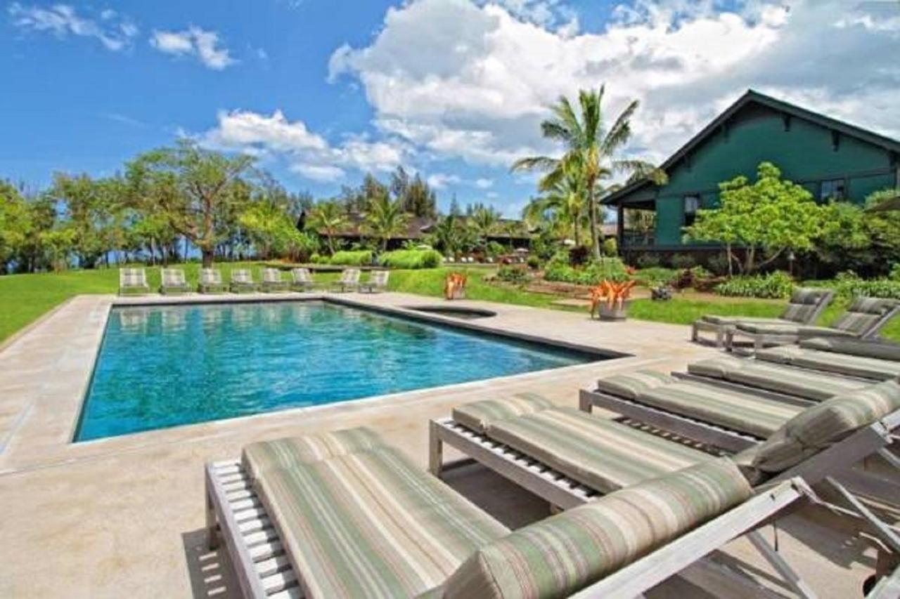 Pool with loungers at Lumeria Maui, Educational Retreat Center.